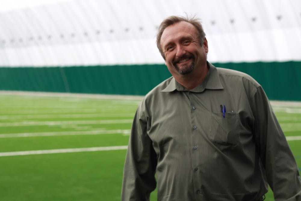 	John Donegan, chief of operations at EMU, poses in Eastern’s new indoor practice facility, which will officially open June 15. The inflatable dome will be used by the women’s soccer team, baseball and softball teams and golf teams. 