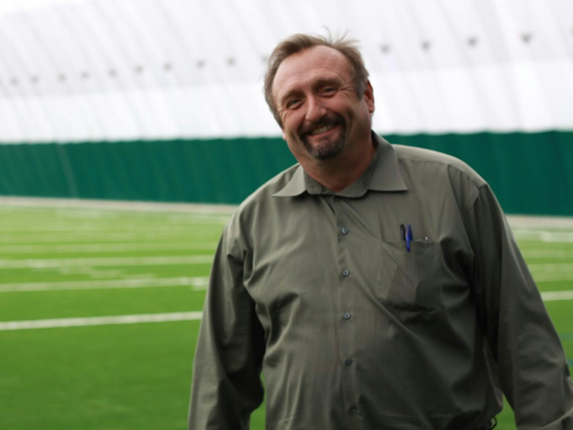 	John Donegan, chief of operations at EMU, poses in Eastern’s new indoor practice facility, which will officially open June 15. The inflatable dome will be used by the women’s soccer team, baseball and softball teams and golf teams. 