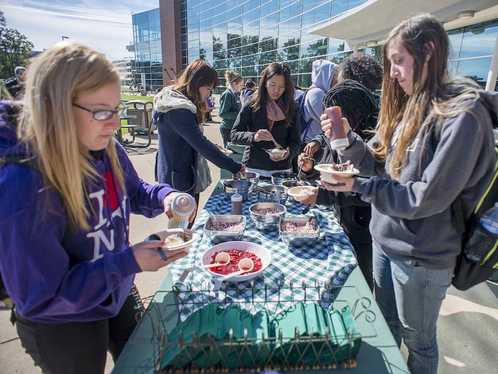 Eastern Michigan students tale their pick of the topping selection at the Ice Cream Social on 9 October at the EMU Student Center.