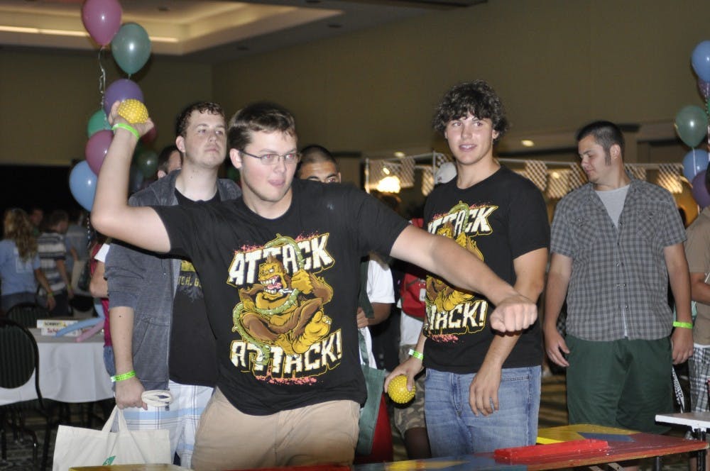 New students play a game in the Student Center ballroom at Eaglepalooza, in which they had to knowkc over bottles to win prizes.