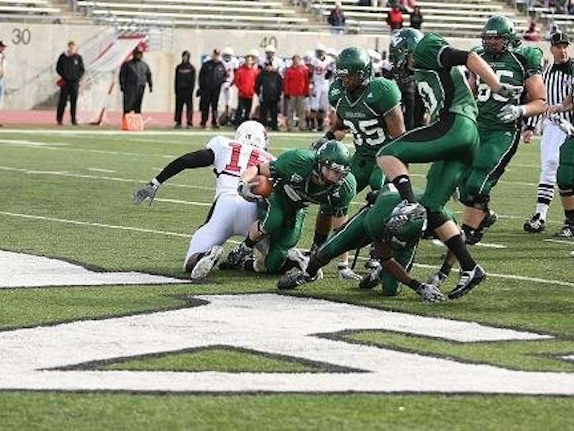 Corey Welch rushes for a 12-yard touchdown in the second quarter at Rynearson Stadium.