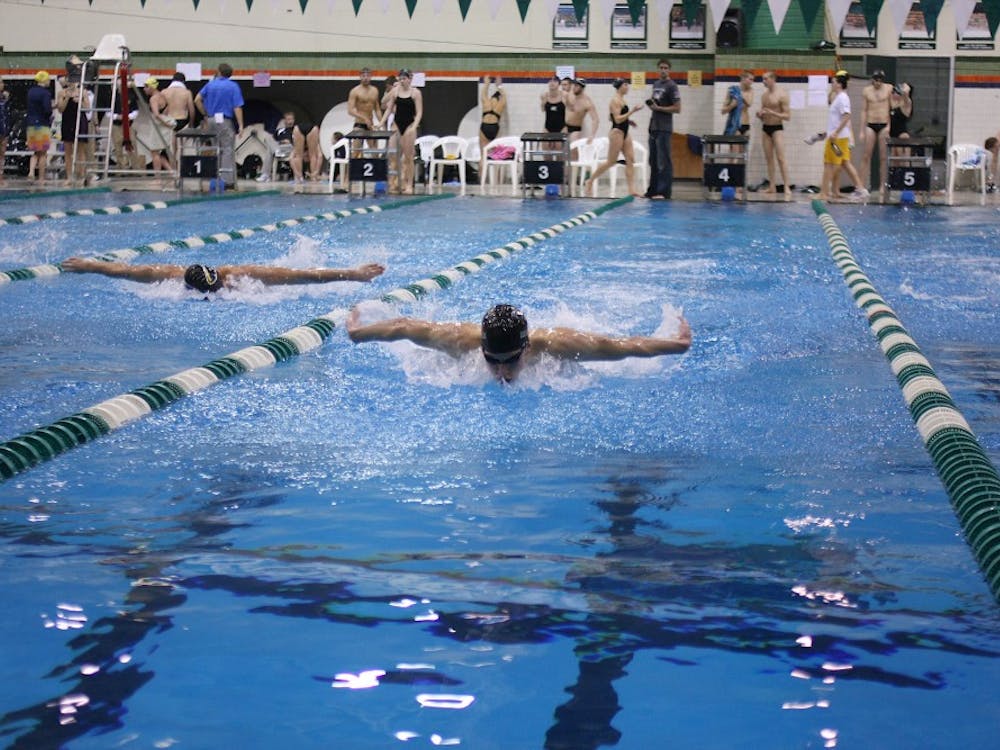 	Eastern Michigan’s Owen Grey (right) swims in the 200-yard butterfly Saturday. He won the event with a time of 1:55.59. EMU won the meet against Wisconsin-Milwaukee.
