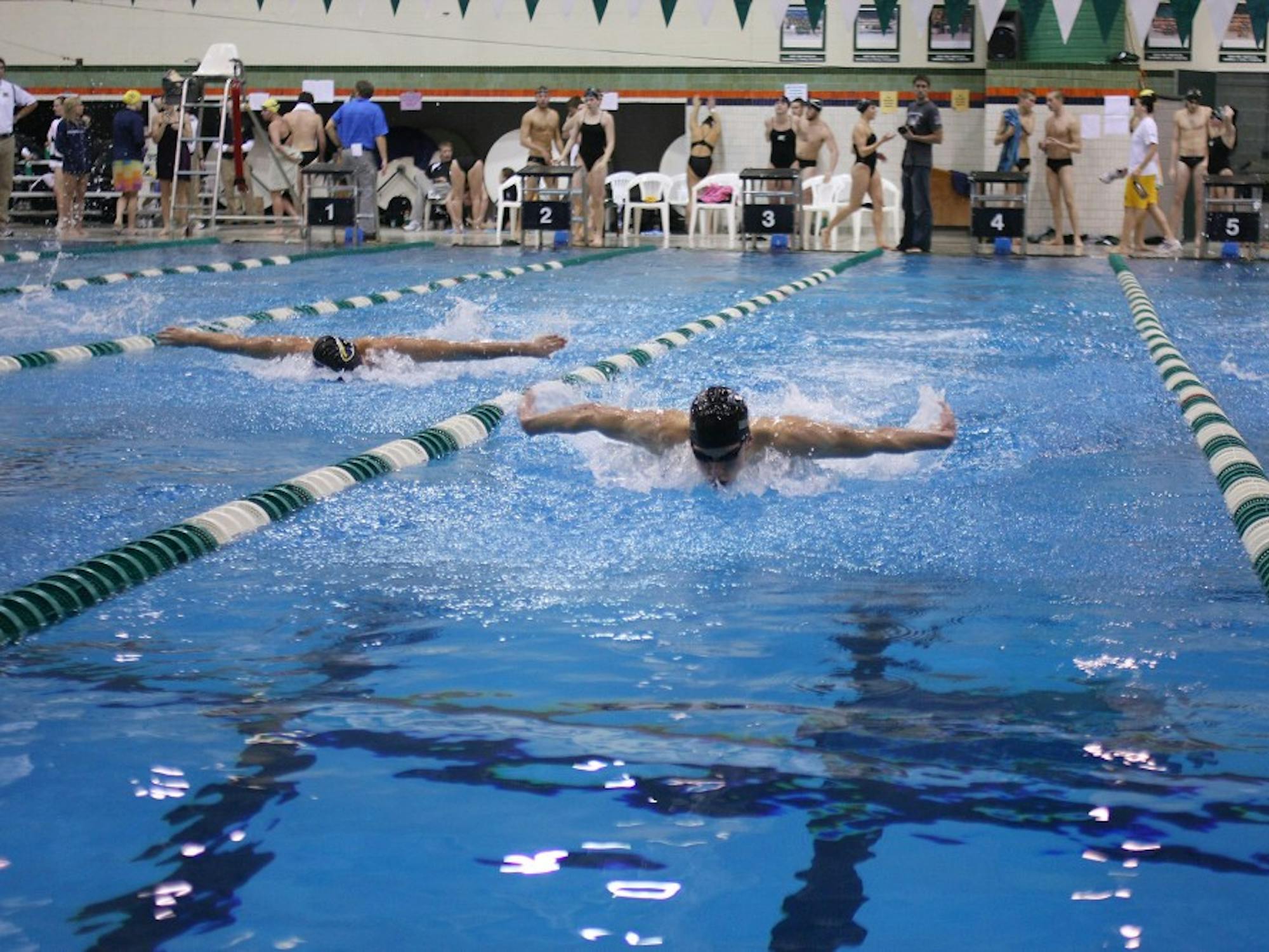 	Eastern Michigan’s Owen Grey (right) swims in the 200-yard butterfly Saturday. He won the event with a time of 1:55.59. EMU won the meet against Wisconsin-Milwaukee.