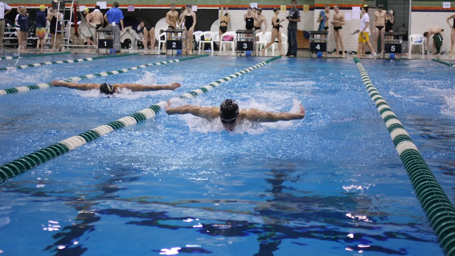 Eastern Michigan’s Owen Grey (right) swims in the 200-yard butterfly Saturday. He won the event with a time of 1:55.59. EMU won the meet against Wisconsin-Milwaukee.