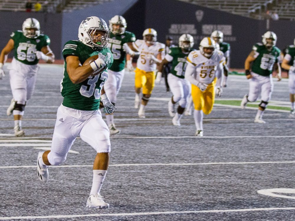 EMU running back Breck Turner rushes for a touchdown during the Eagles&#x27; 27-24 win over Wyoming.