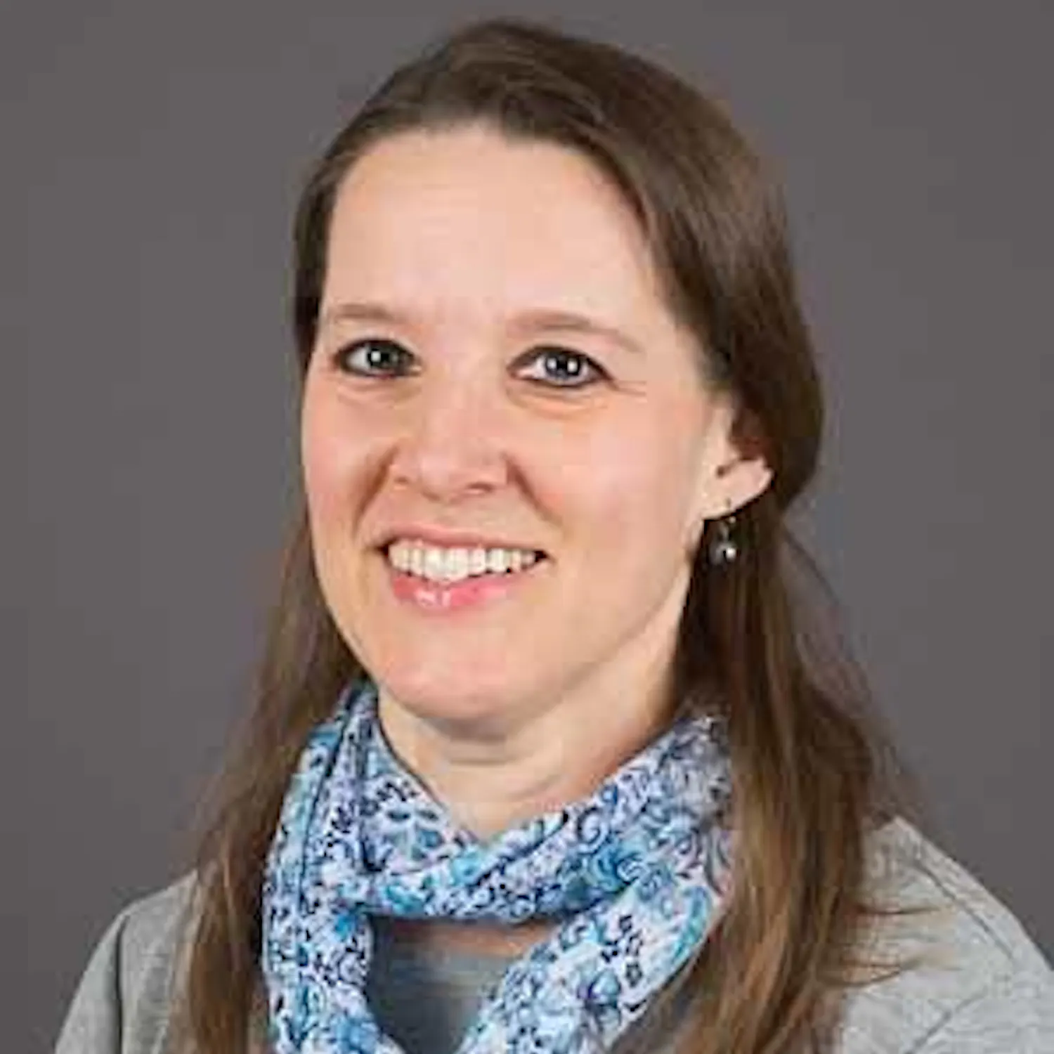 Professional headshot of Jennifer Fisher, shown from the shoulders up.