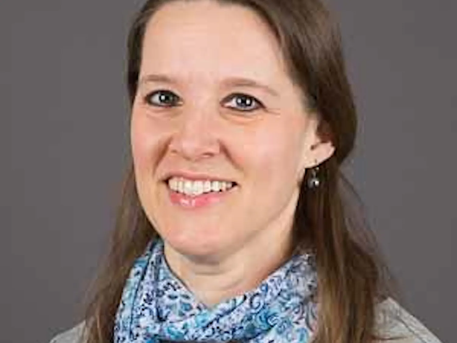 Professional headshot of Jennifer Fisher, shown from the shoulders up.
