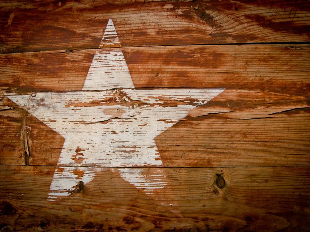 A brown and white wooden star print board.
Photo by Glen Carrie on Unsplash.