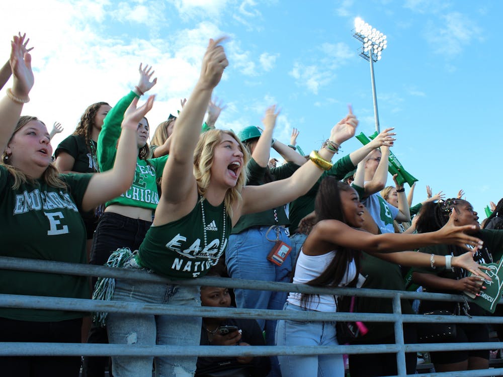 Students at Eastern Michigan University&#x27;s homecoming football game try to win free EMU t-shirts by cheering the loudest. [Did Caroline M. take this photo?]