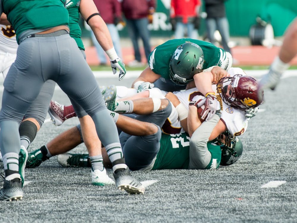 Central Michigan&#x27;s running back gets tackled by Eastern Michigan on Nov. 1 at Rynearson Stadium. 
