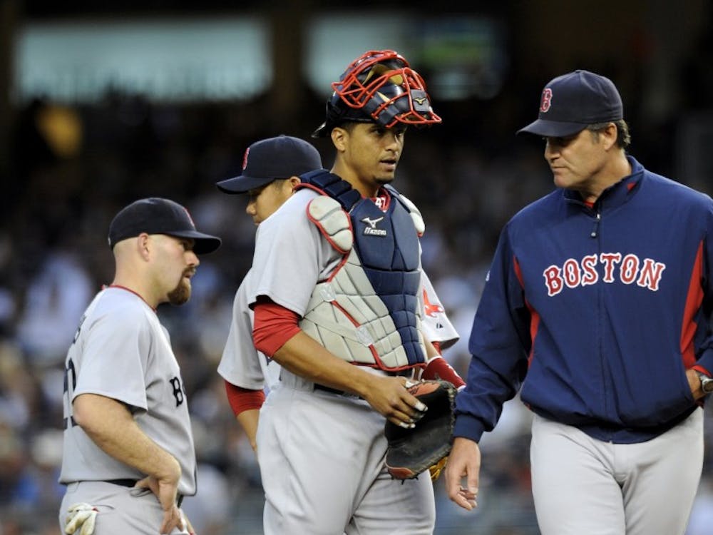 Former Boston Red Sox catcher Victor Martinez walks back to the plate after visiting pitcher Daisuke Matsuzaka in the first inning at Yankee Stadium. Martinez has landed a position at the Detroit Tigers, and will add to the offensive strength, currently lacking in the team.