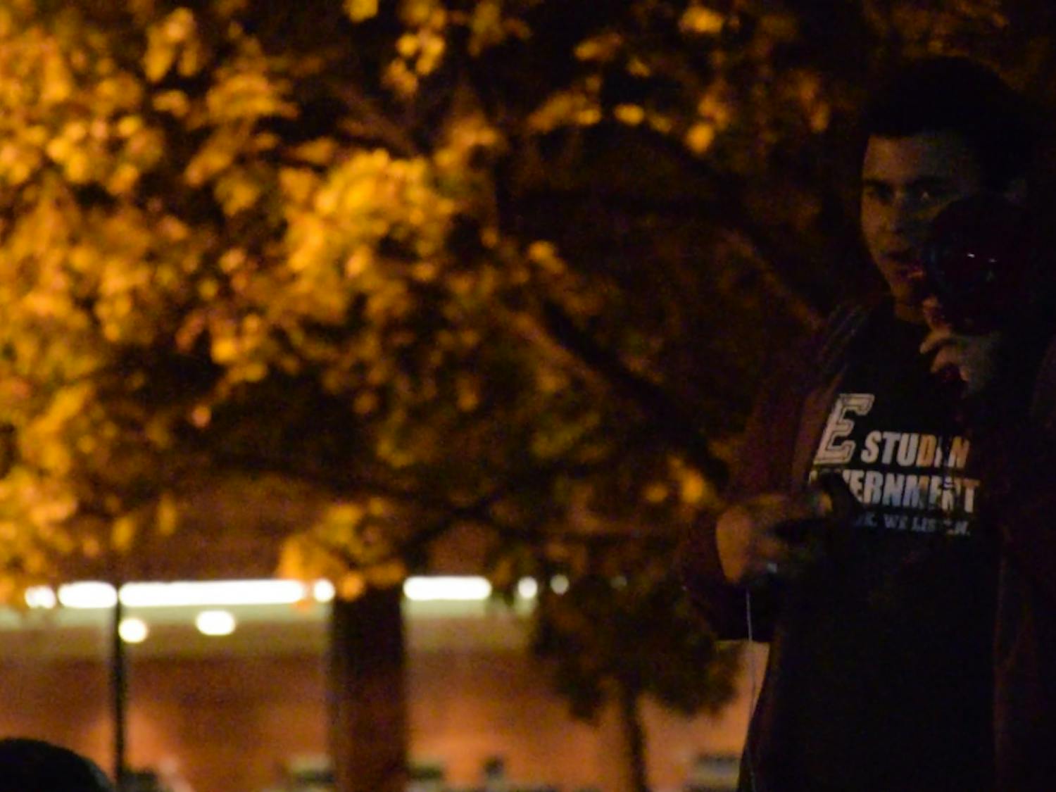 Protest co-organizer Sam Jones-Darling addresses the gathered crowd at the #notmypresident rally outside of McKenny Hall on Monday, Nov. 14. 