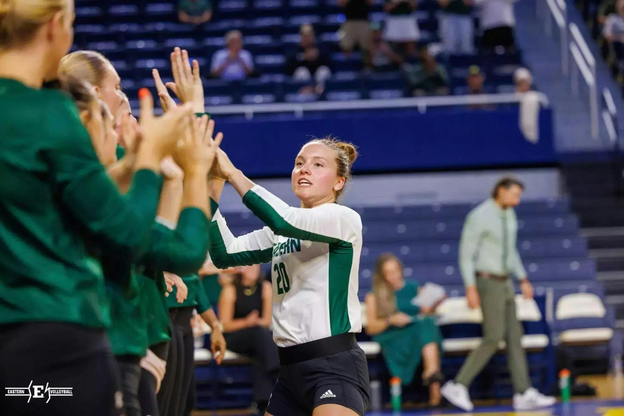 Player Hannah Blaney high-fives her teammates.