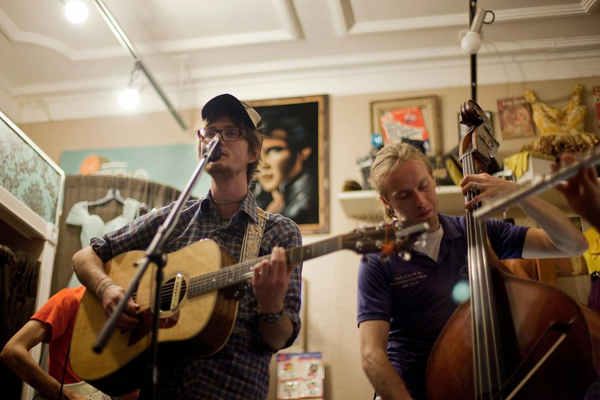 Nathan Klages (left) plays with friends at The Getup vintage clothing store in Ann Arbor on September 10, 2009.