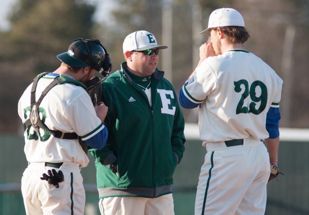 Eastern Michigan pitching coach Eric Peterson chats with Paul Schaak in the Eagles 5-3 loss to the Michigan State Spartans Tuesday night.