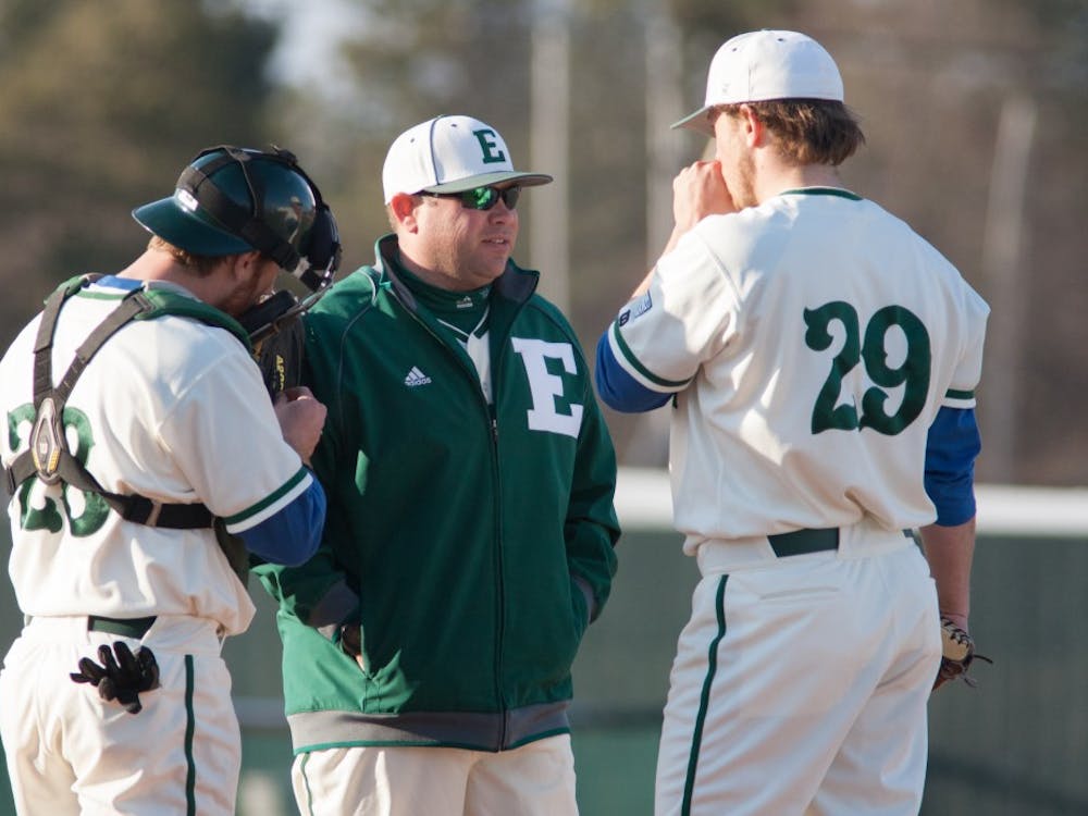 Eastern Michigan pitching coach Eric Peterson chats with Paul Schaak in the Eagles 5-3 loss to the Michigan State Spartans Tuesday night.