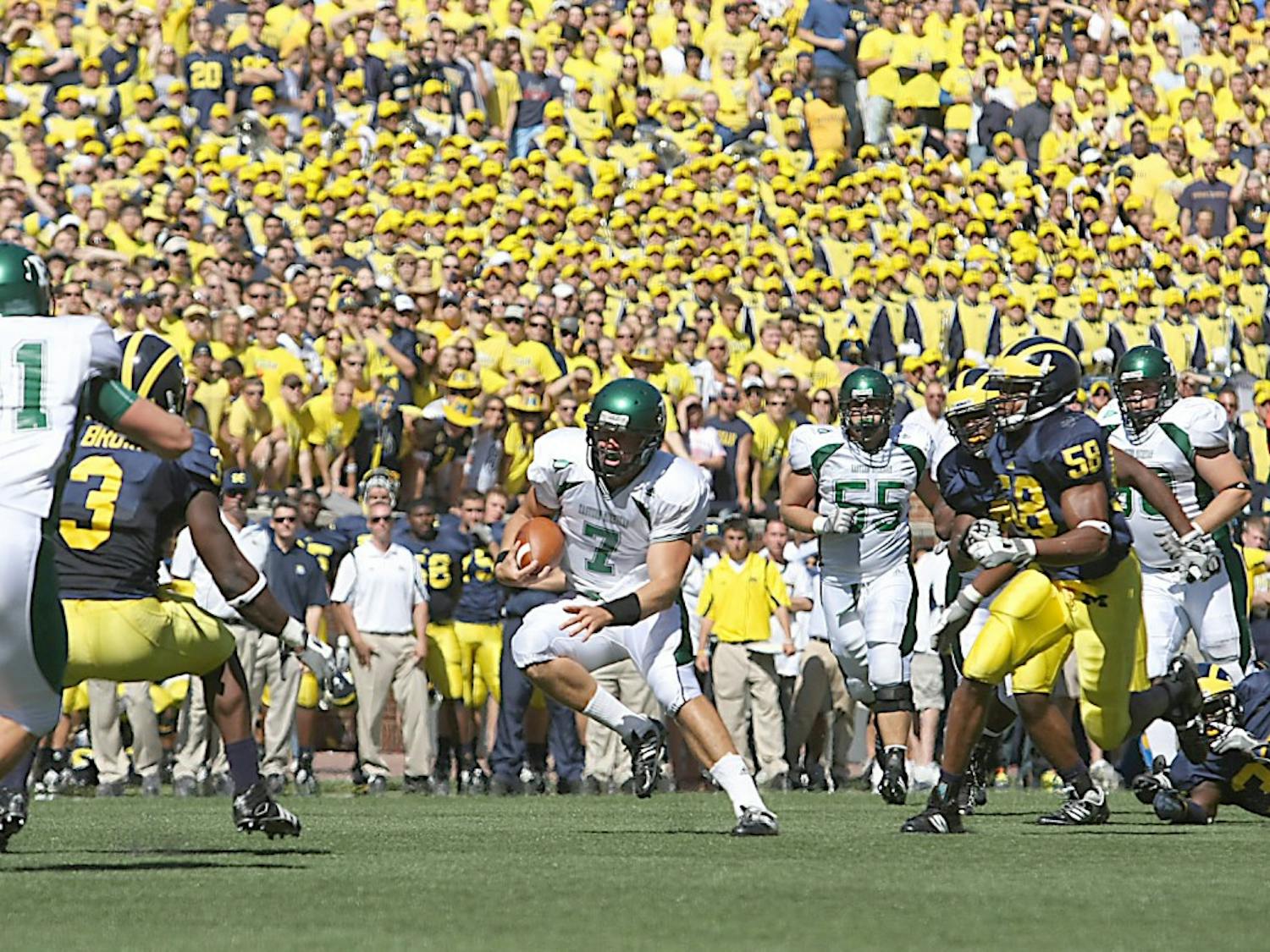 Andy Schmitt (7) runs on Saturday against Michigan. He later left during the fourth quarter with a season-ending knee injury.