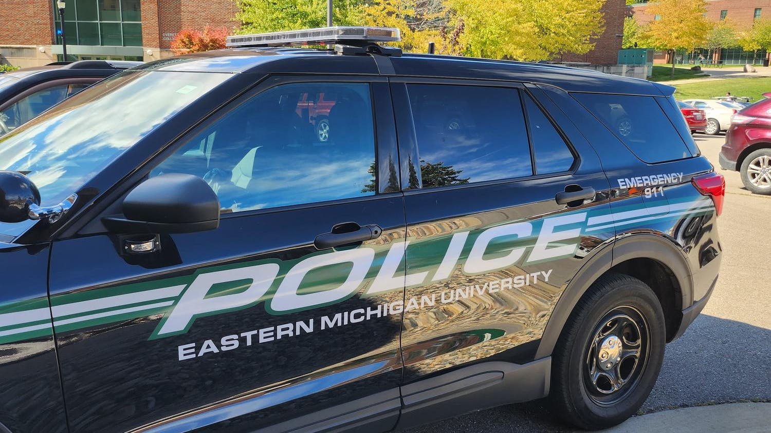 A police-labeled vehicle used by the Eastern Michigan University Department of Public Safety is parked on campus.