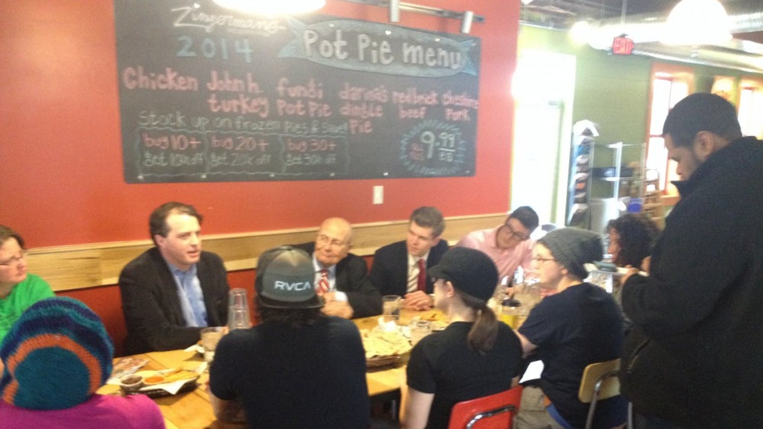 	Congressman John Dingell, D-Ann Arbor (center), Representative Jeff Irwin (second from left) and Representative Adam Zemke (second from right), both D-Ann Arbor, meet with employees of Zingerman&#8217;s Deli and the media on Friday to discuss a proposed increase to the minimum wage.
