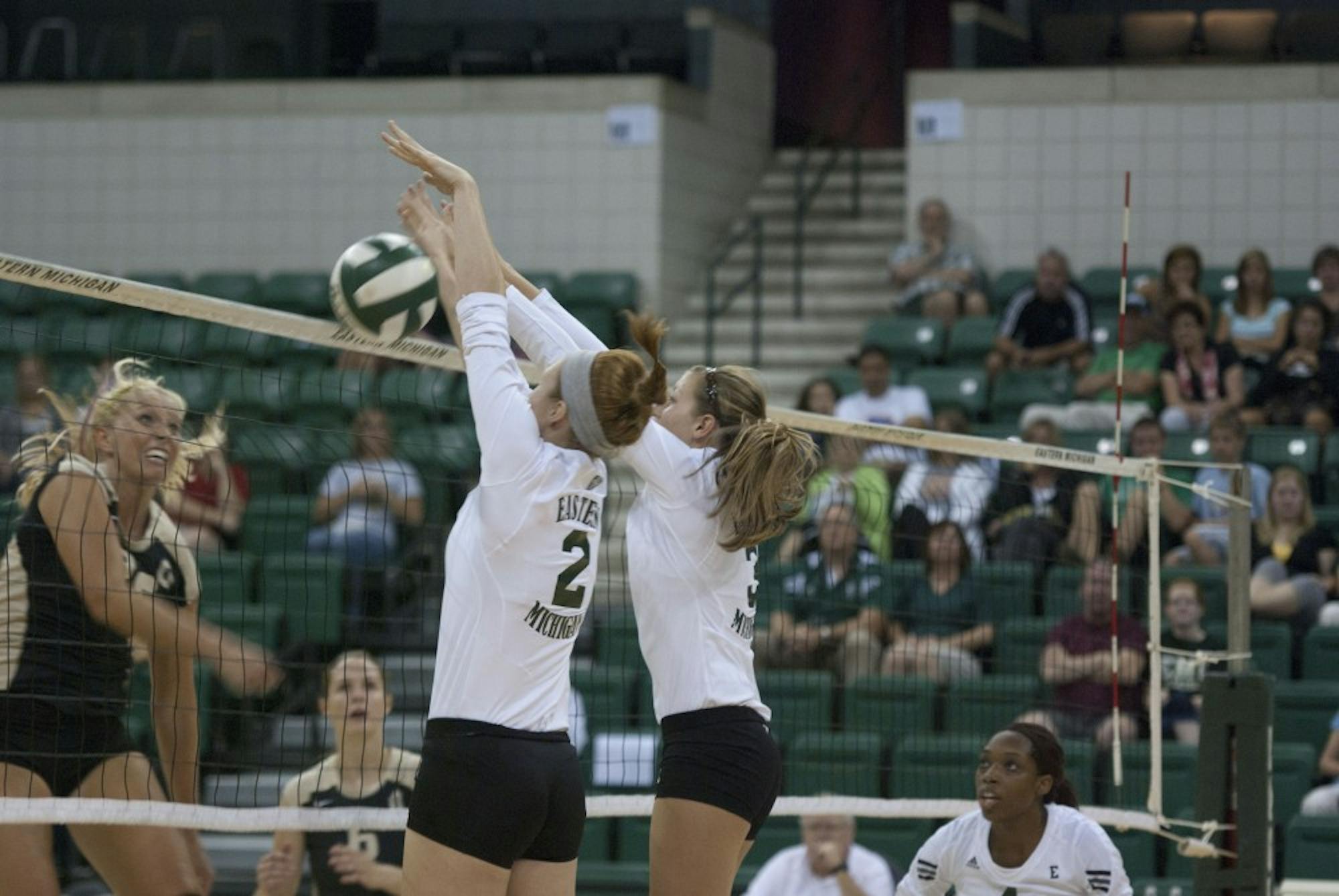 	Kaitlyn Vincek and Carolyn Steger work together to send the ball back over to IUPUI opposition.