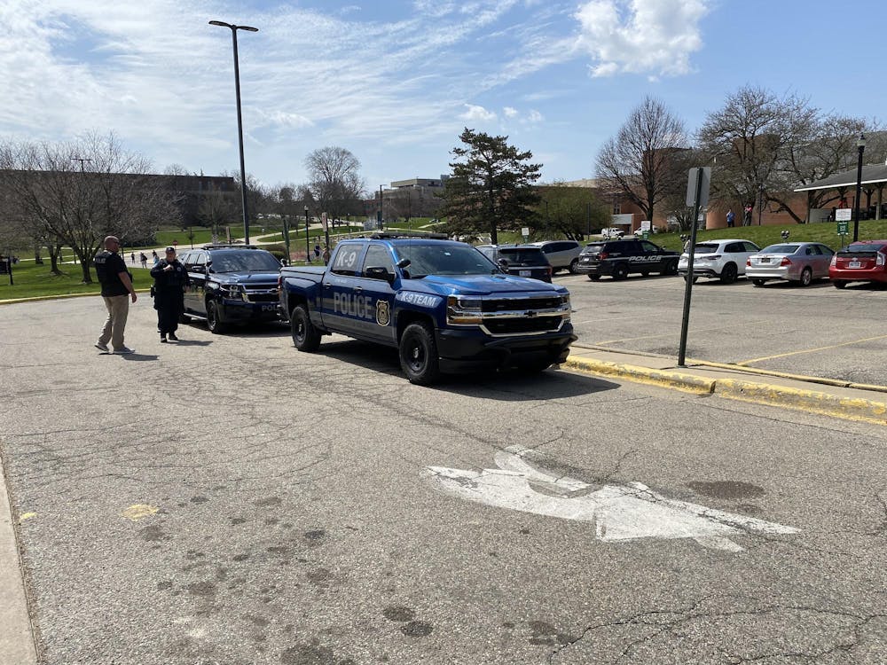 Police arrive outside of Buell Hall on April 9 after a bomb threat alert was sent to the campus community via the Rave Alert system.