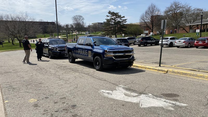 Police arrive outside of Buell Hall on April 9 after a bomb threat alert was sent to the campus community via the Rave Alert system.