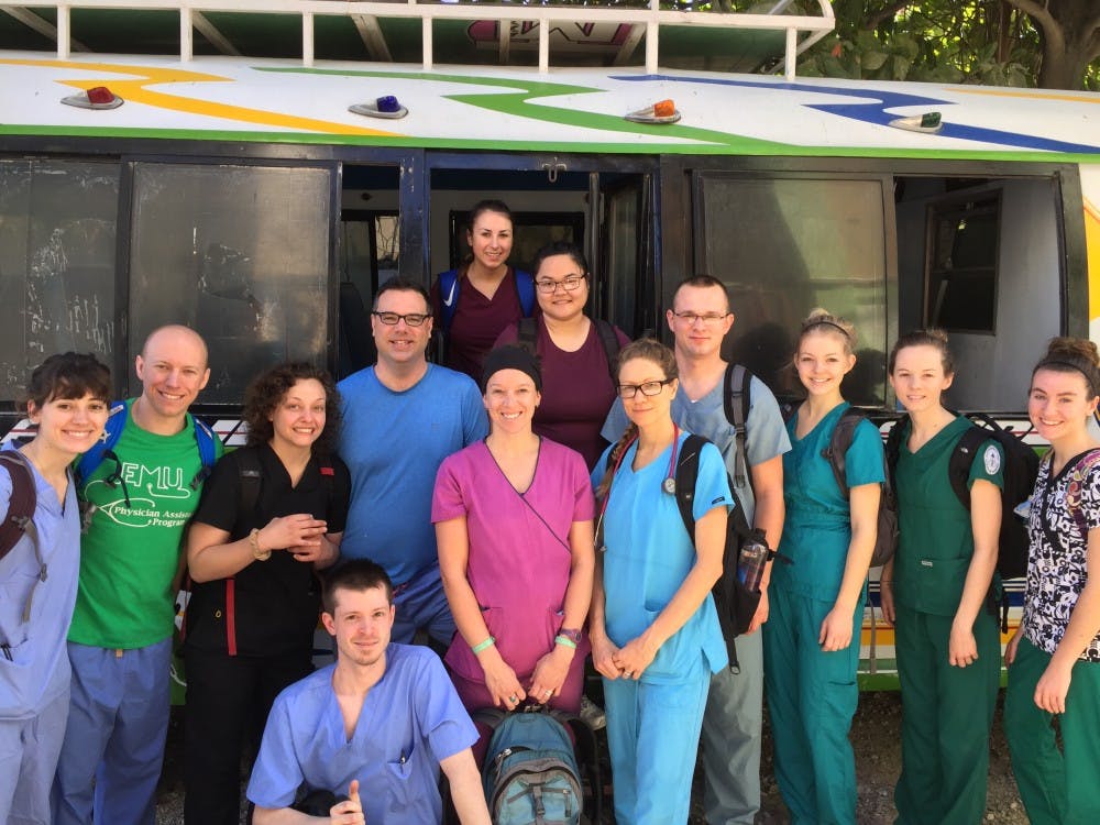 Back: Amber Buchanan (first year student nursing), in front and to right of her Mariel Berdin (2nd year nursing student).Middle row left to right: Katie Towns (1st year PA student), Adam Ancel (PA-C, graduate of EMU's inaugural PA program), Emily Batdorff (first year PA student) Eric Marshall (PA-C, graduate of EMU's inaugural PA program), Marinda Ramey (2nd year nursing student, president of SNA), Shannon Poe (1st year nursing student), Dean Kot (first year PA student), Gretchen Gunderson (1st year nursing student), Megan Henry (nursing student) and Melody Wesseling (nursing student). Front: Chris Cox, paramedic&nbsp;