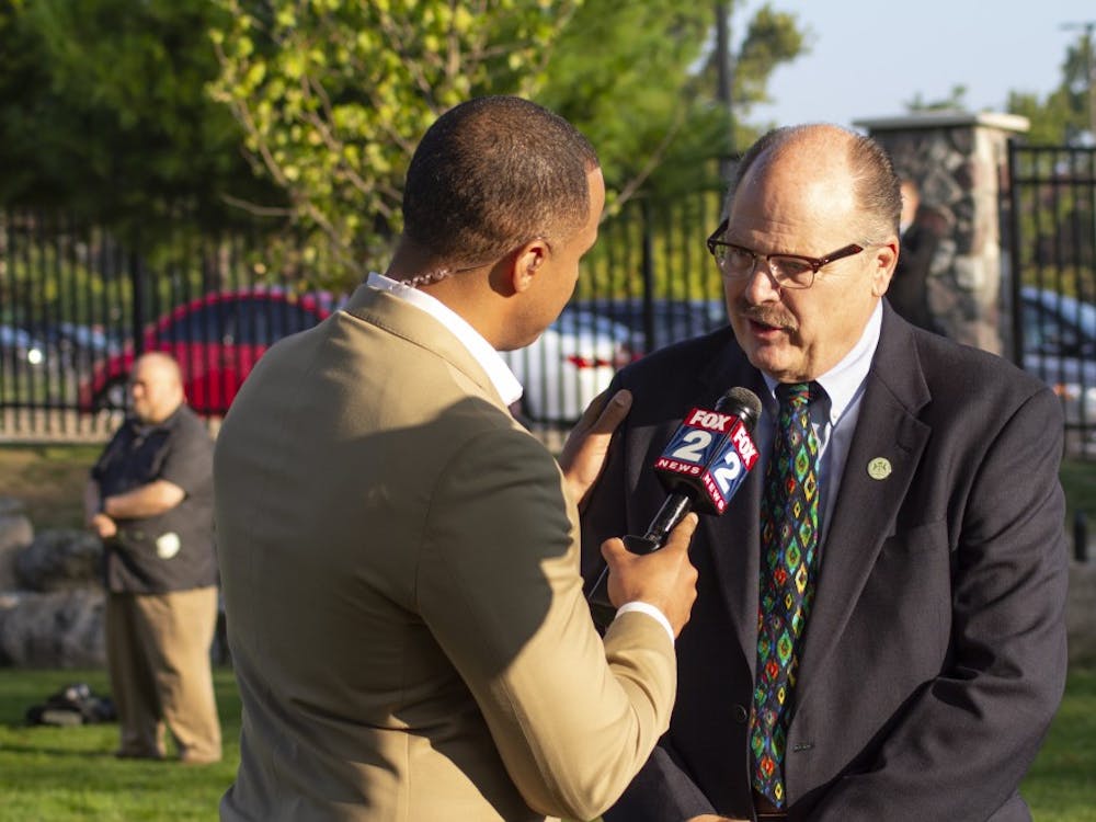 EMU President James Smith being interviewed by FOX 2 news at the 9/11 ceremony of remembrance, to honor the lives that were lost, as well as the lives of the survivors. It was his fourth time attending the ceremony.