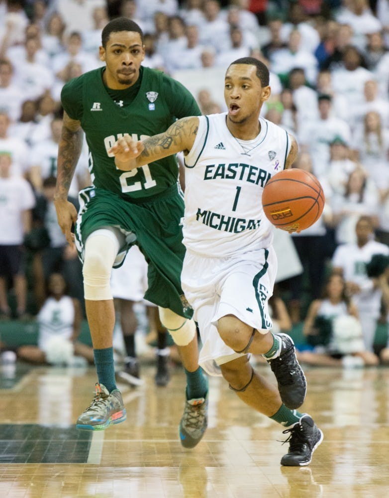EMU guard Mike Talley drives past Ohio forward John Smith (21) in Eastern Michigan's 58-56 loss to Ohio Saturday.