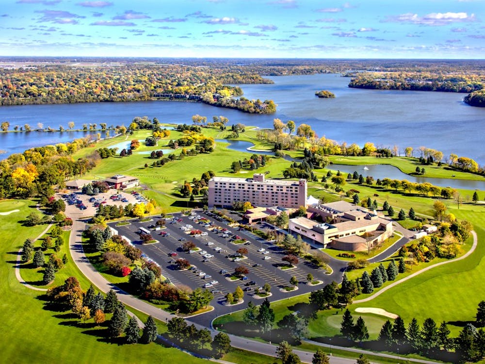Aerial Helicopter photograph of Eastern Michigan University’s Golf Course and the Ann Arbor Ypsi Marriott at Eagle Crest in the Fall. Ford Lake is in the background.