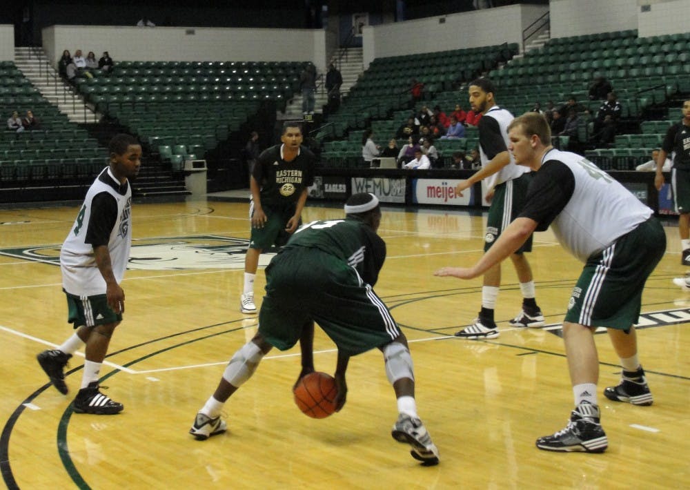 EMU men's basketball green and white