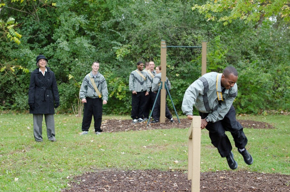 	EMU junior and ROTC Cadet Damion Brooks demonstrates how to use part of the new recreation course just west of Cornell Courts apartments.