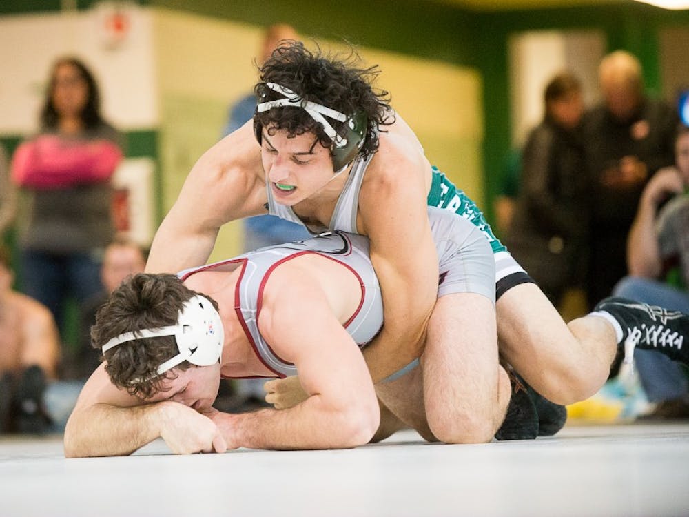 Eastern Michigan wrestler Nicholas Barber fights the competition at the EMU Open on 15 November in Bowen Field House.