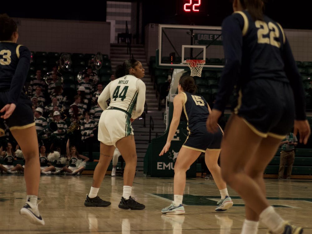 EMU's Kennedi Myles (44) finds herself surrounded by Akron's swarming defense. Photo taken February 7, 2024.