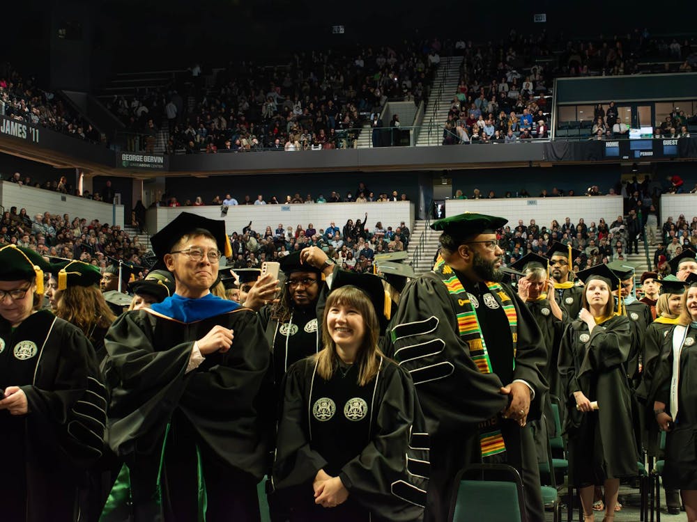 Eastern Michigan University graduates gather for Winter Commencement ceremonies Sunday, Dec. 17, 2023, at the George Gervin GameAbove Center.