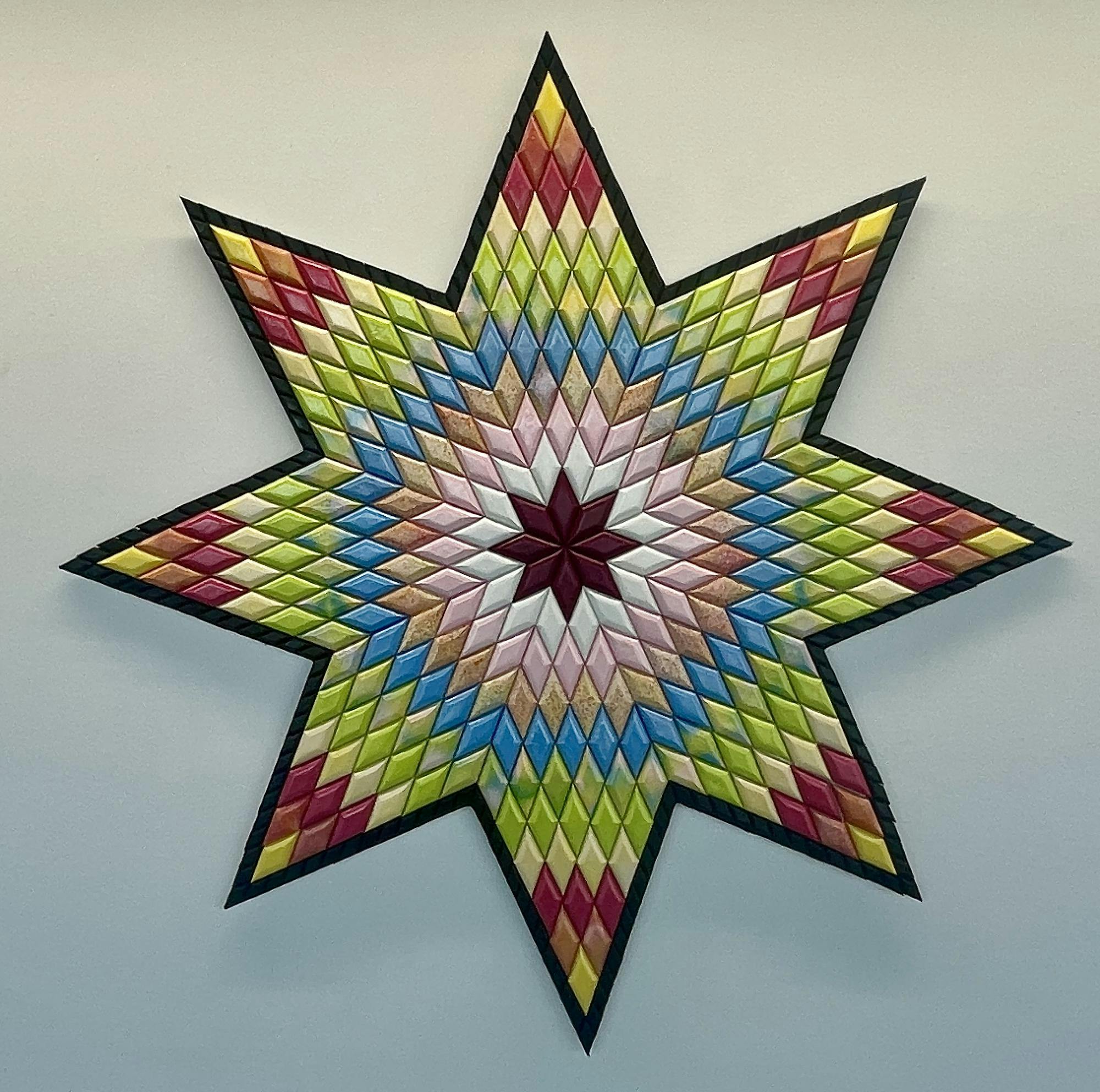 8-pointed star filled with many diamond shapes inside it. The diamonds create circular bands of color throughout the work, similar to a fabric quilt style.
