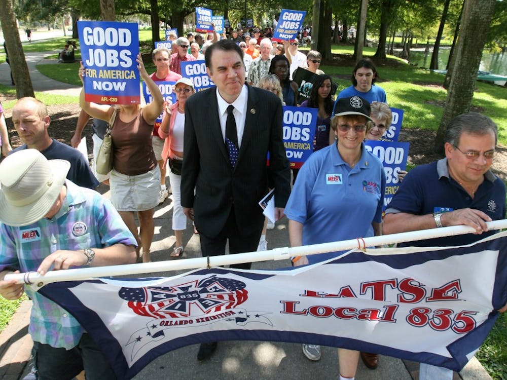 Congressman Alan Grayson walks with union members during the AFL-CIO Labor Day Jobs Rally, at Lake Eola Park in downtown Orlando, Florida, Monday, September 6, 2010. 