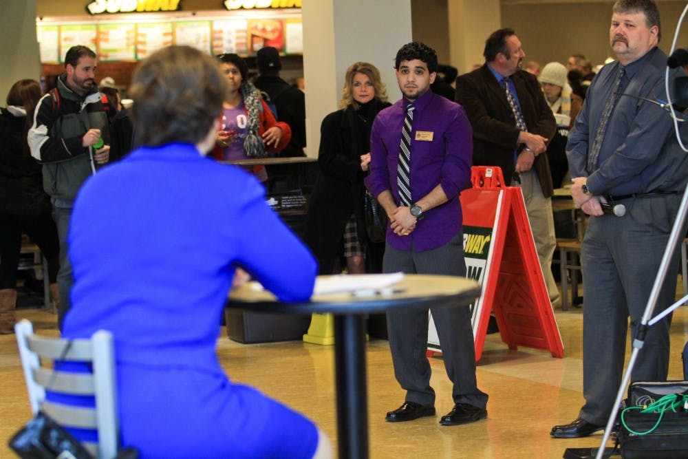 Various campus officials stand by to assist in the question and answer session held in the Student Center food court.