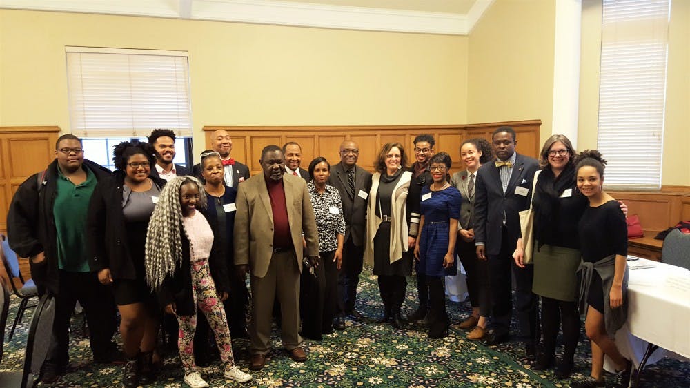 Members of Presidential discussion panel and attendee's pose for a photo together.&nbsp;