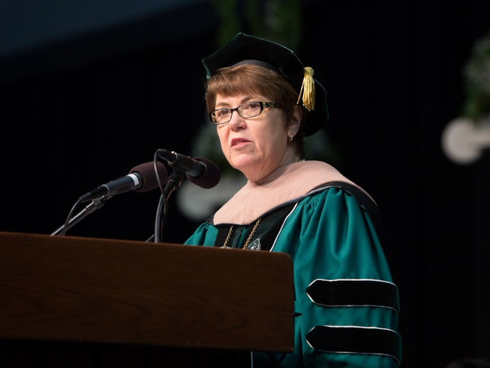 Eastern Michigan University President Dr. Susan Martin speaks before the graduates on Sunday morning at the Convocation Center.