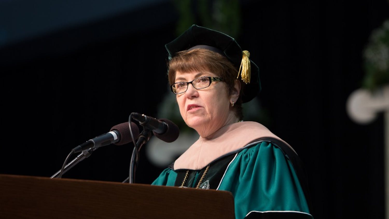 Eastern Michigan University President Dr. Susan Martin speaks before the graduates on Sunday morning at the Convocation Center.