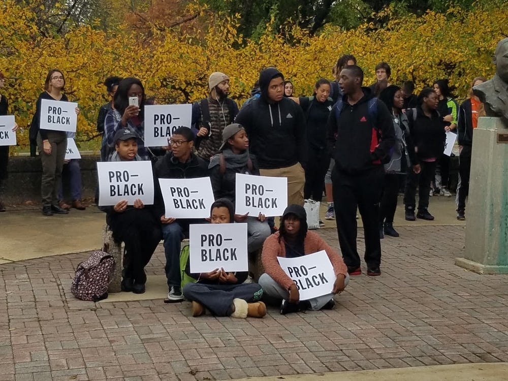 Protesters holding "pro-black" signs at the&nbsp;rally outside of Ford Hall at Eastern Michigan University on Wednesday, Nov. 2 to protest racism and the racial graffiti incidents on campus over the past month.