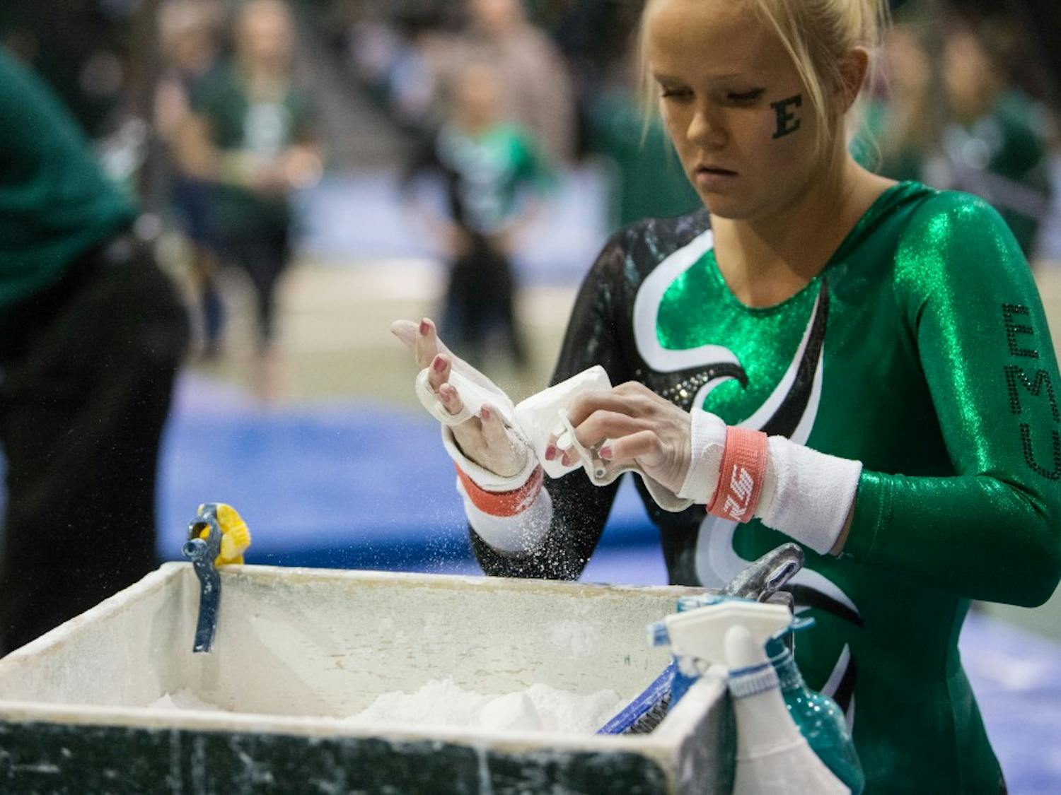 Eastern Michigan junior Nikki Paterson gets ready to perform on the bars in the Eagles 195.925-194.600 loss to Central Michigan Friday night.