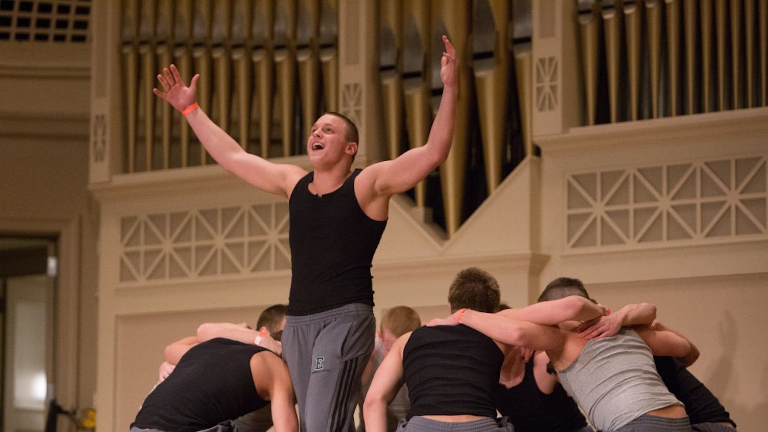 The men’s swimming team performs at Jock Jamz Tuesday night at Pease Auditorium. They took first place in the competition.