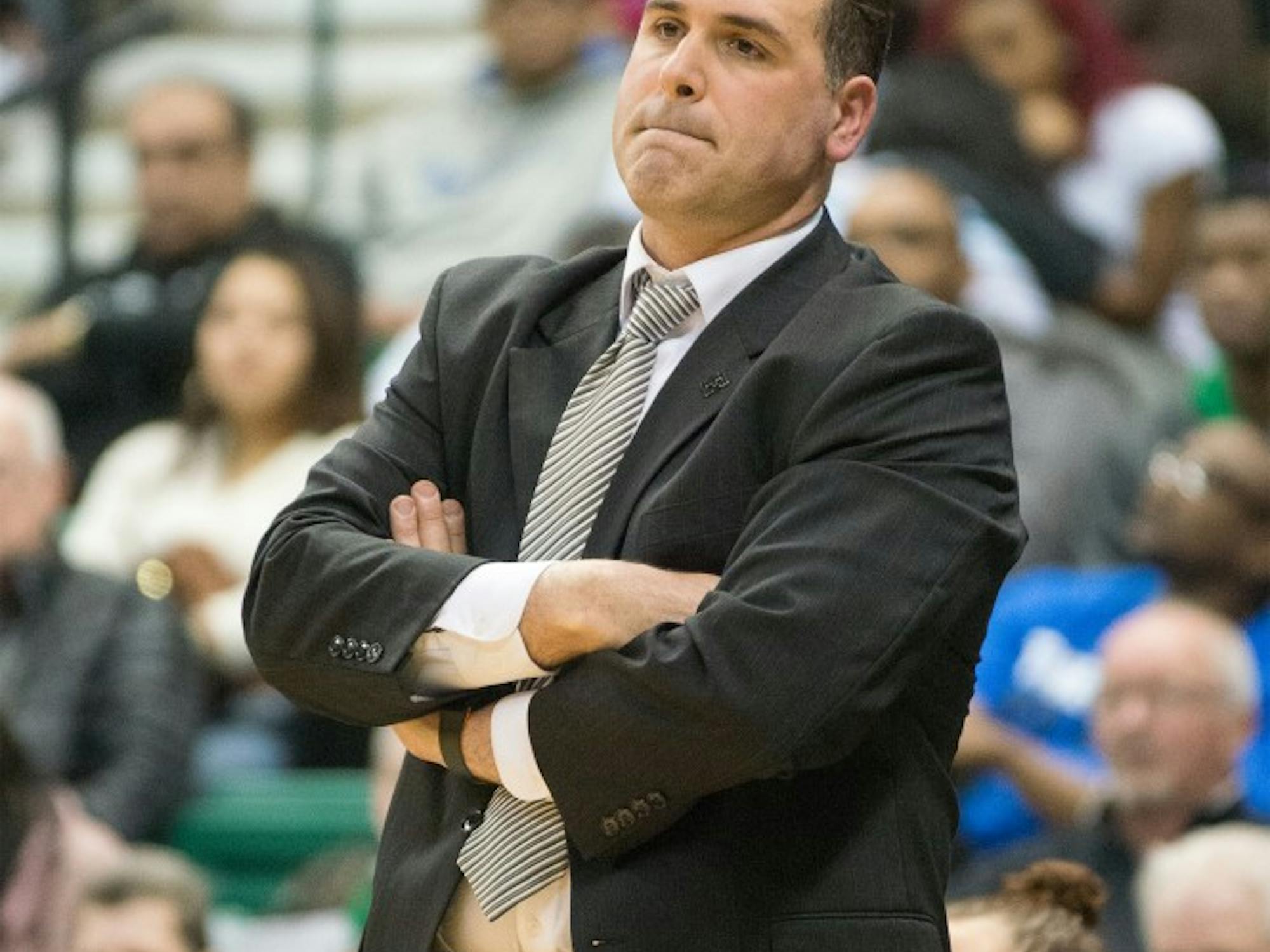 Eastern Michigan head coach Tory Verdi doesn't look happy about the poor first-half performance of the Eagles during their game against Central Michigan on 8 March at the Convocation Center.  The second half turned around, and EMU won 99-83 in an overtime thriller.