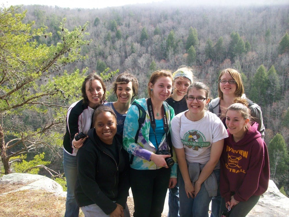 	Students who visited the Everglades take a break to pose for a picture in front of the scenery.