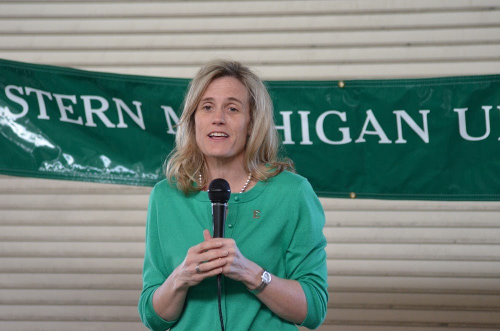 Eastern Michigan Vice President and Director of Intercollegiate Athletics Heather Lyke speaks in front of the crowd.