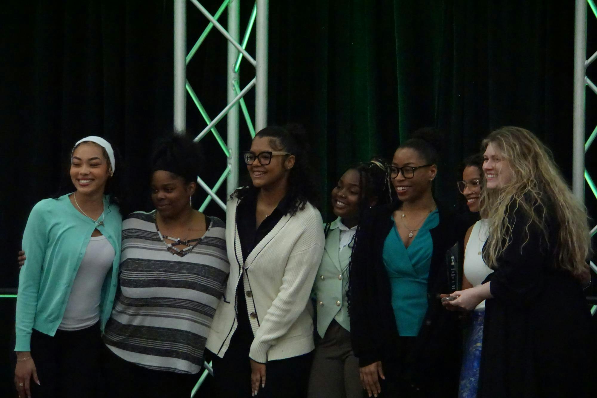 The You Beautiful Black Women Organization poses on stage with their award.