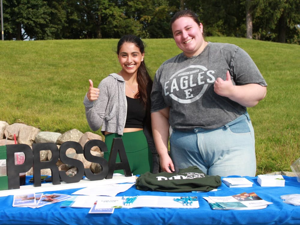 Nina Scarpelli (right) and Kathleen Inman (left) provides students with information and resources on EMU's PRSSA. Photo Credit: EMU PRSSA