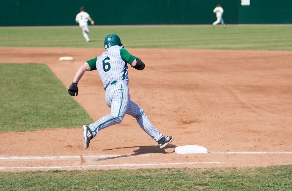 Ty Gilmore rounds first in the fourth inning during the Eastern Michigan vs. Ohio University baseball game at Ohio University in Athens, Ohio on Saturday, April 26, 2014.